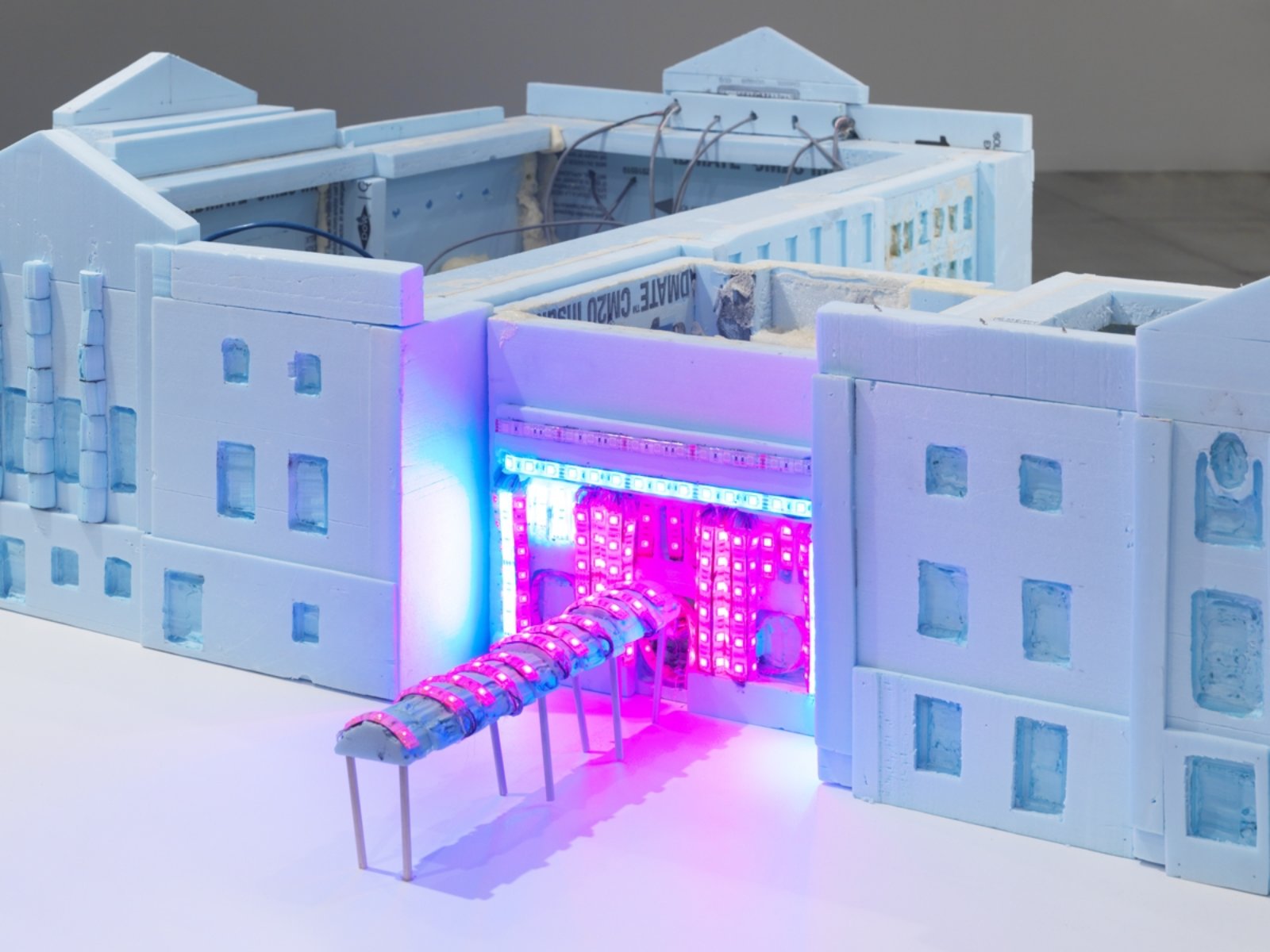 Kevin Schmidt, RGB Beg Cycle, 2018, styrofoam model of vancouver art gallery with led lights, dmx controllers, customized recording software, midi keyboards, electronics, computer, audio broadcast over radio, led lighting on exterior of gallery, dimensions variable. Installation view, We Are the Robots, Vancouver Art Gallery, Vancouver, 2018