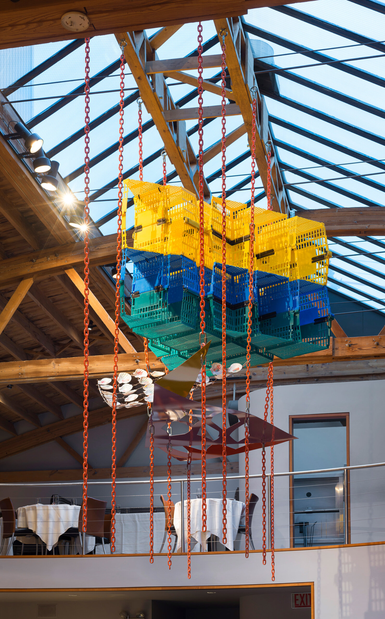 Jessica Stockholder, Another Piece of Pie, 2015, plastic shopping baskets, metal plate, paint, chains, hardware, metal rod, scallop shells, 144 x 132 x 72 in. (366 x 335 x 183 cm). Installation view, MN Restaurant, Chicago, USA