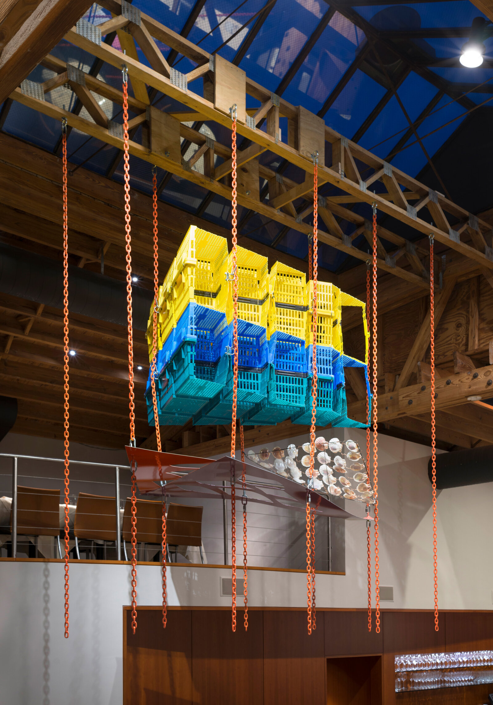 Jessica Stockholder, Another Piece of Pie, 2015, plastic shopping baskets, metal plate, paint, chains, hardware, metal rod, scallop shells, 144 x 132 x 72 in. (366 x 335 x 183 cm). Installation view, MN Restaurant, Chicago, USA