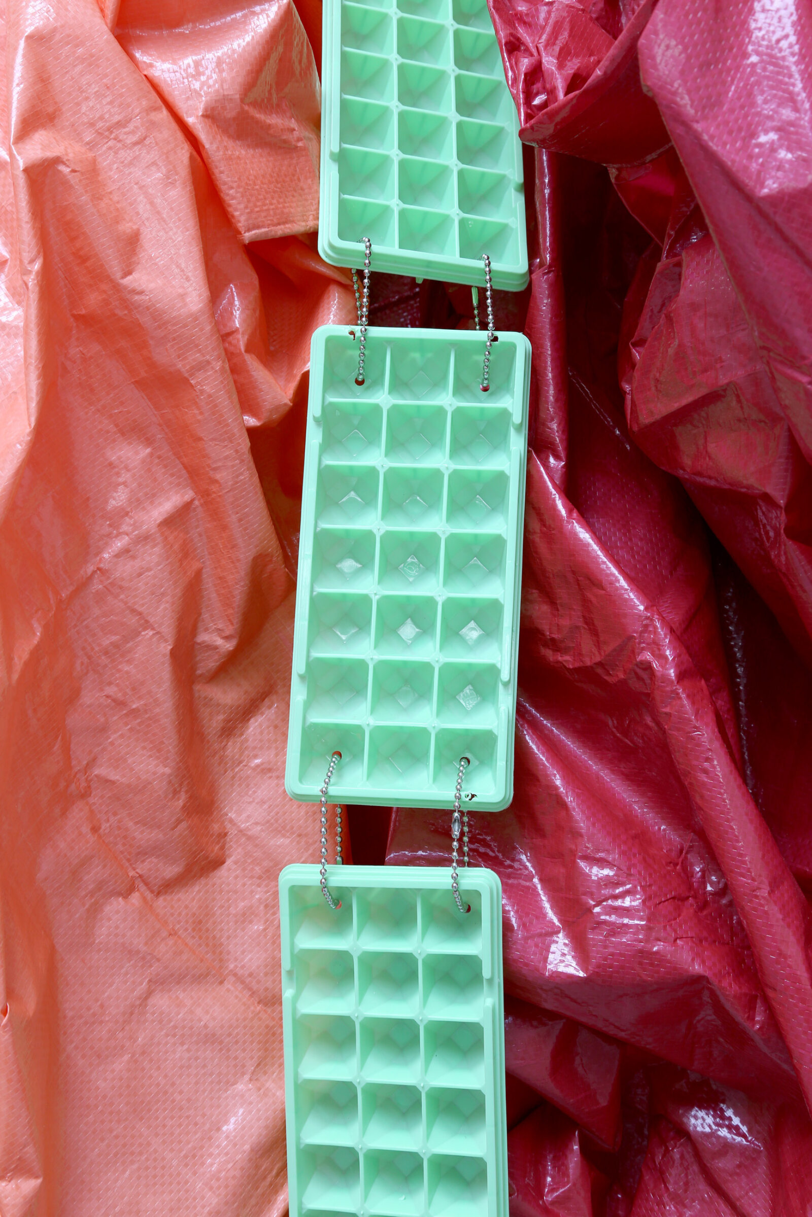 Jessica Stockholder, Curtsy in the Blind (detail), 2015, 2 driveway mirrors, custom hardware, 2 tarps, ice trays, plastic parts, fabric, acrylic paint, 110 x 60 x 24 in. (279 x 152 x 61 cm)