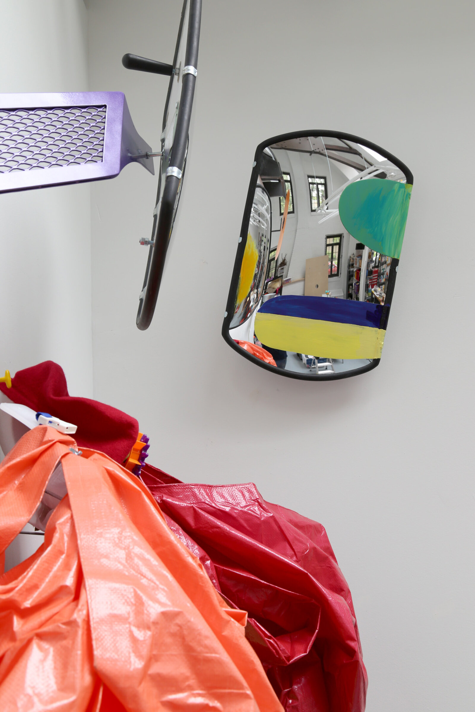Jessica Stockholder, Curtsy in the Blind (detail), 2015, 2 driveway mirrors, custom hardware, 2 tarps, ice trays, plastic parts, fabric, acrylic paint, 110 x 60 x 24 in. (279 x 152 x 61 cm)