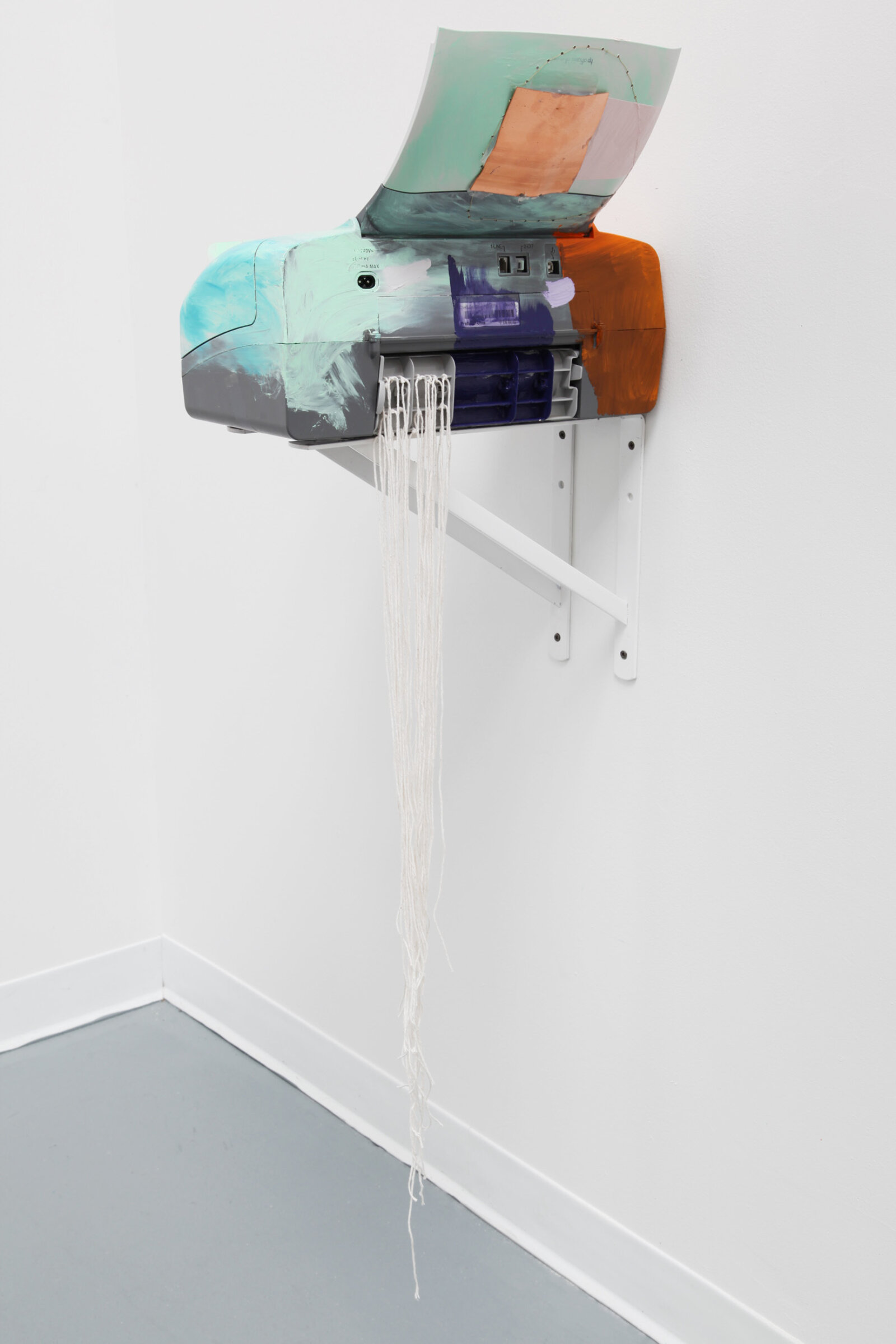 Jessica Stockholder, Hairspray, 2017, printer, oil paint, copper plate, cotton string, silk scarf, 2 white brackets, 52 x 17 x 17 in. (131 x 43 x 43 cm)