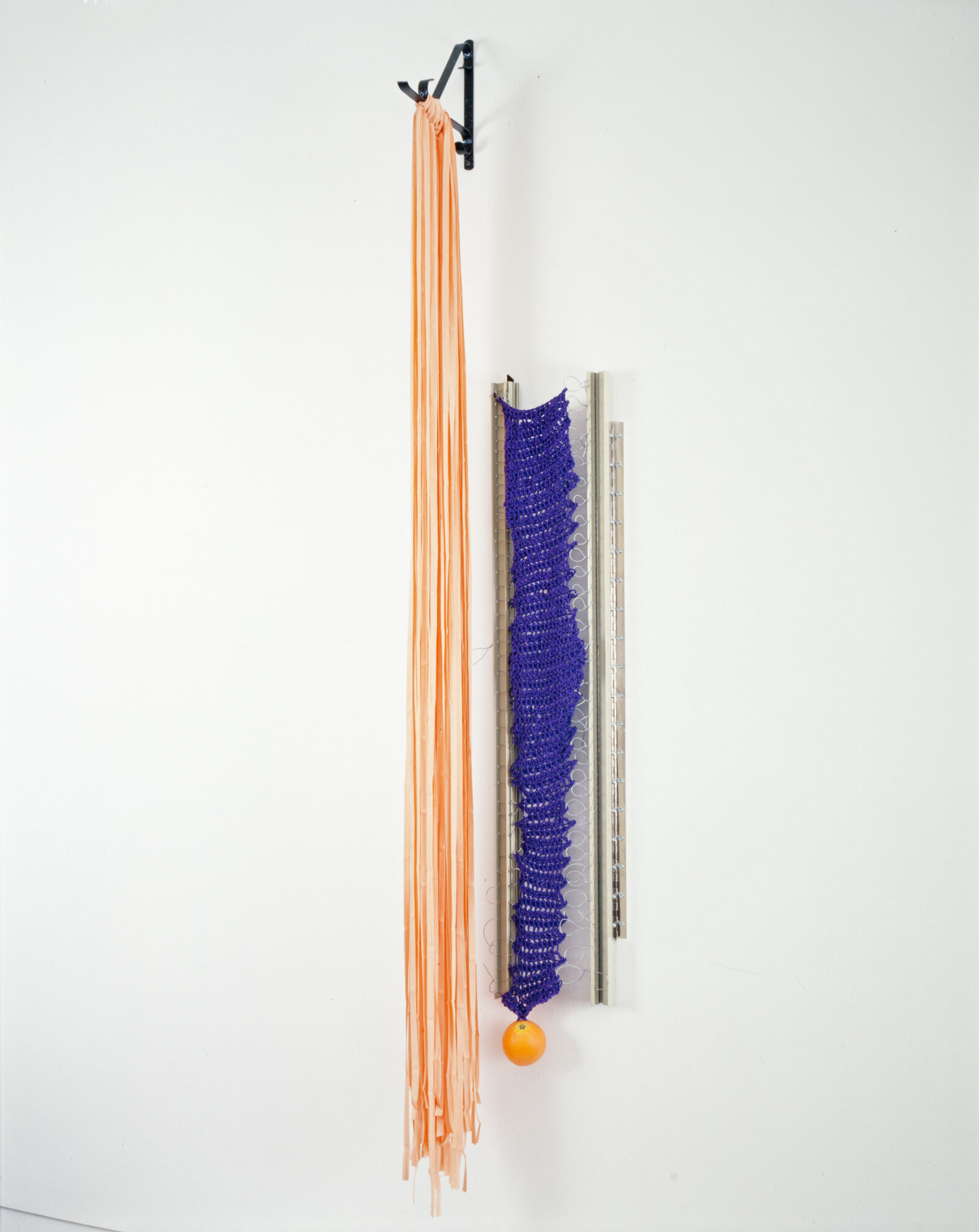 Jessica Stockholder, JS240, 1994, wall bracket, bias tape, window sashes, acrylic yarn, plastic orange, wire, hinges, 83 x 14 x 10 in. (212 x 36 x 25 cm)