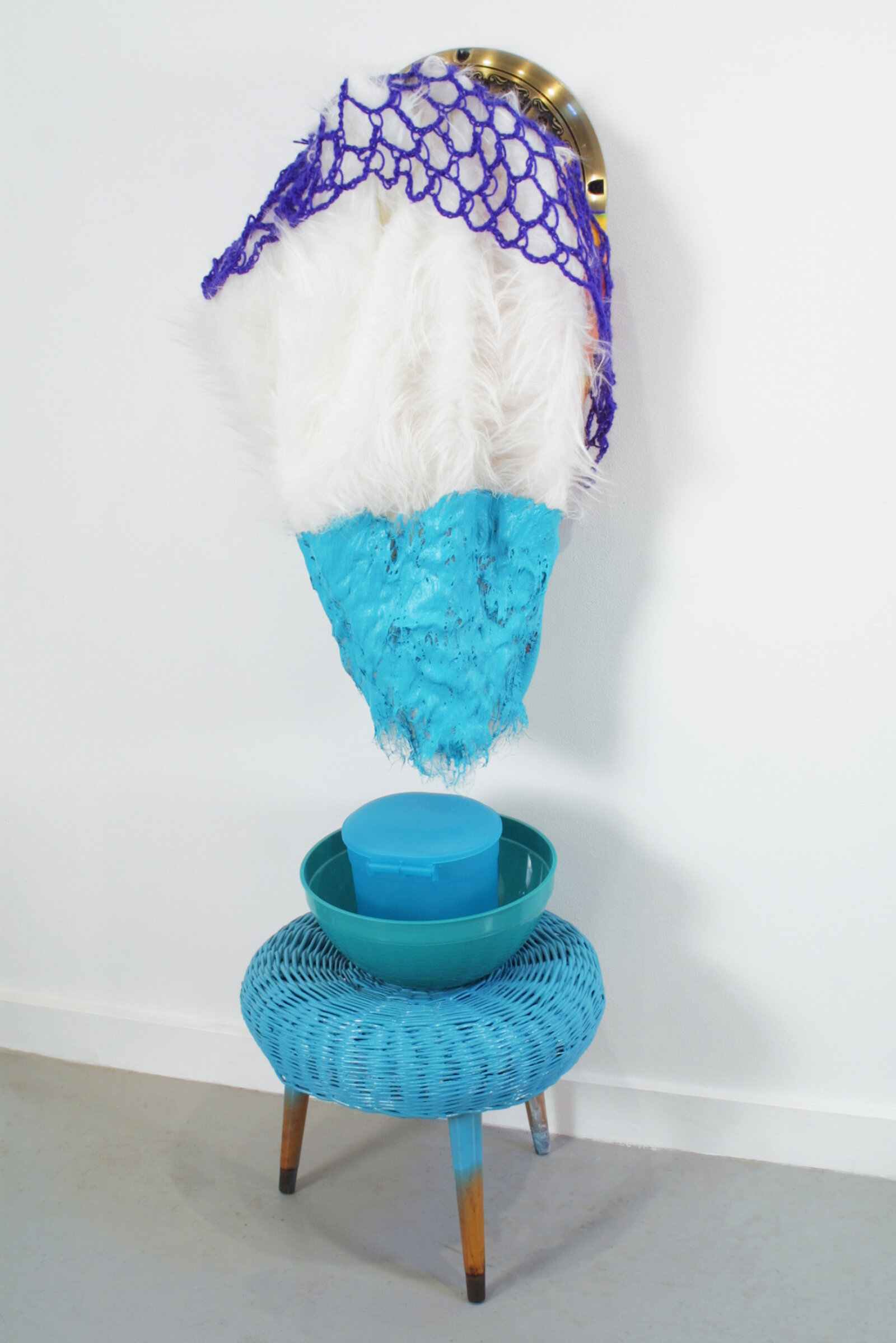 Jessica Stockholder, JS385, 2003, fan collar, white fake fur, fabric, crocheted acrylic yarn, plastic containers, wicker stool, 55 x 20 x 18 in. (140 x 51 x 45 cm)