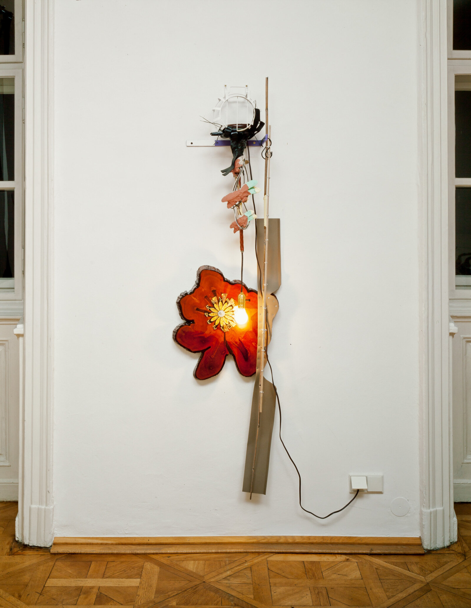 Jessica Stockholder, JS454, 2007, wooden clock, rubber molding, light bulb, wire, bamboo, wooden dowel, dragonfly lamp, metal hardware, black tape, plastic parts, acrylic and oil paint, 80 x 18 x 9 in. (202 x 46 x 23 cm)