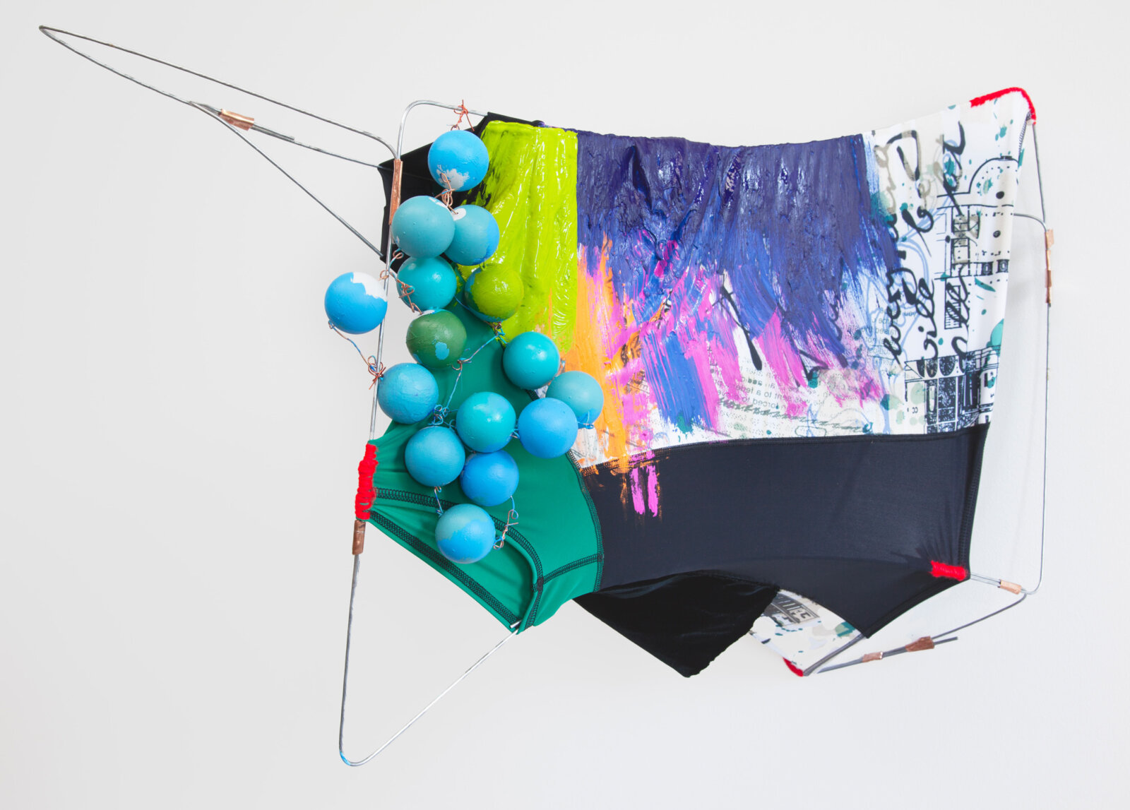 Jessica Stockholder, JS537, 2012, bent wire, nylon swim shirt, ping pong balls, acrylic paint, yarn, copper flashing, crushed velvet, 14 x 29 x 19 in. (36 x 74 x 48 cm)