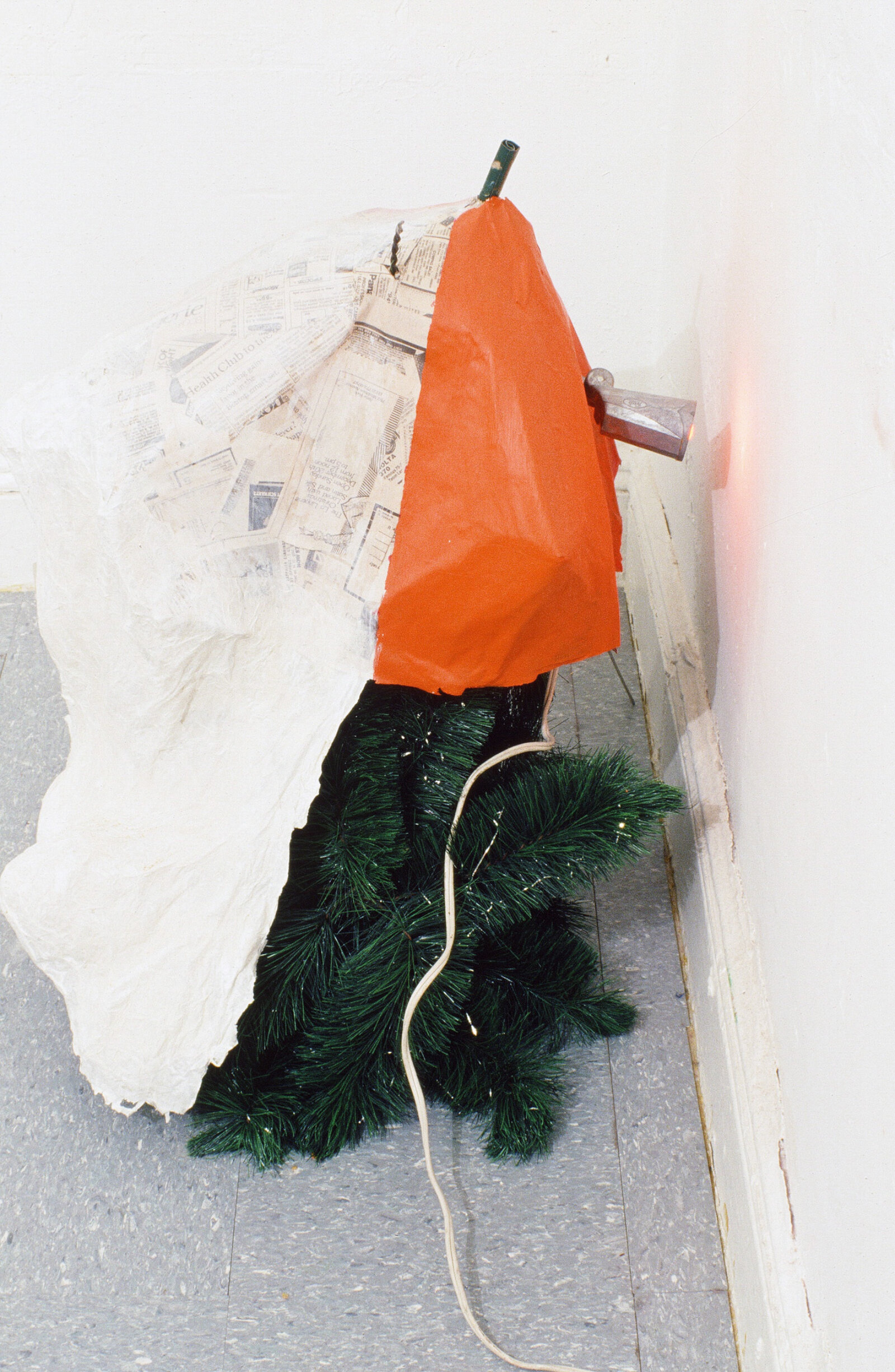 Jessica Stockholder, Kissing the Wall #3, 1988, fake christmas tree, paper maché, paint, lamp