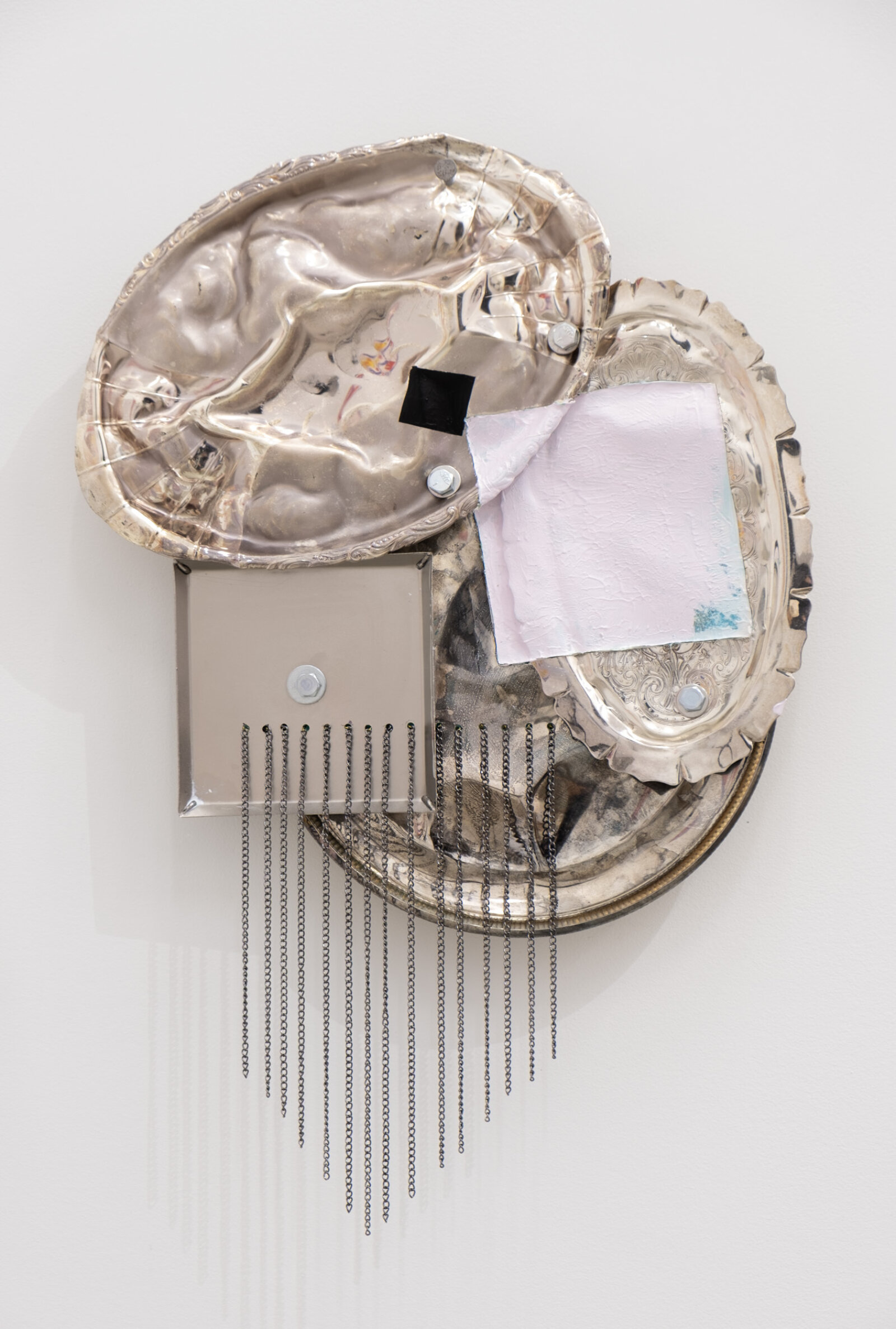 Jessica Stockholder, Origin of the World, 2026, metal trays, hardware, acrylic paint, chain, 20 x 14 x 4 in. (51 x 36 x 9 cm)