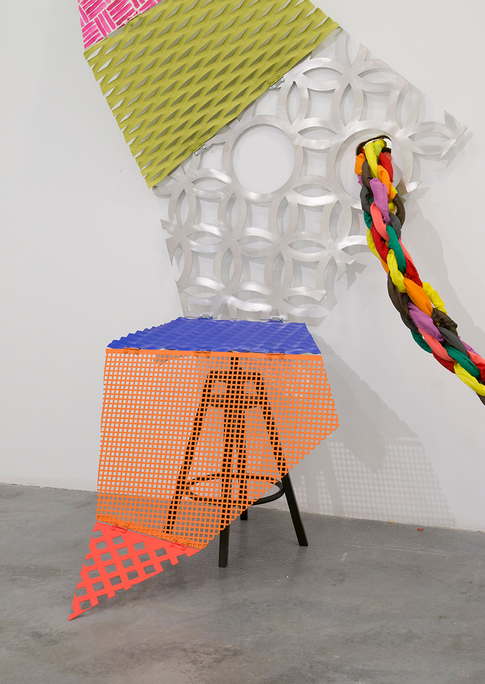 Jessica Stockholder, Tied to be fit – middle period (detail), 2021, perforated sheets, hinges, bolts, paint, stool, 84 x 66 x 44 in. (214 x 168 x 112 cm)