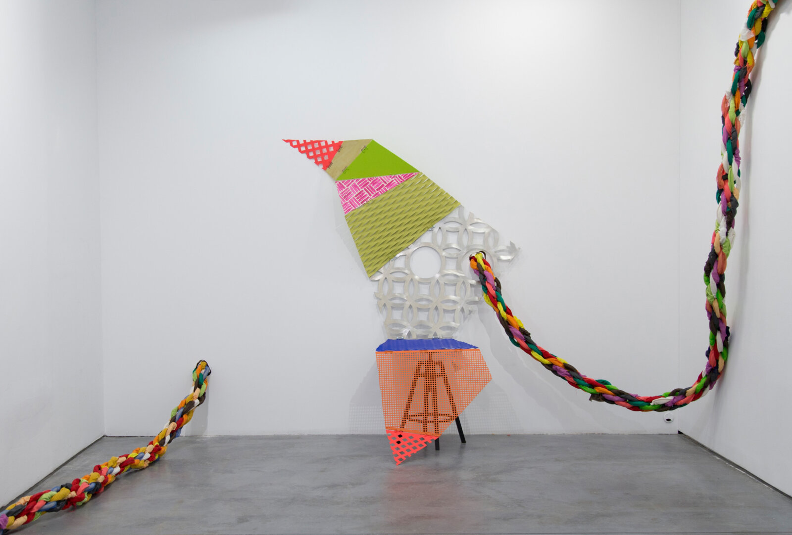 Jessica Stockholder, Tied to be fit – middle period, 2021, perforated sheets, hinges, bolts, paint, stool, 84 x 66 x 44 in. (214 x 168 x 112 cm)