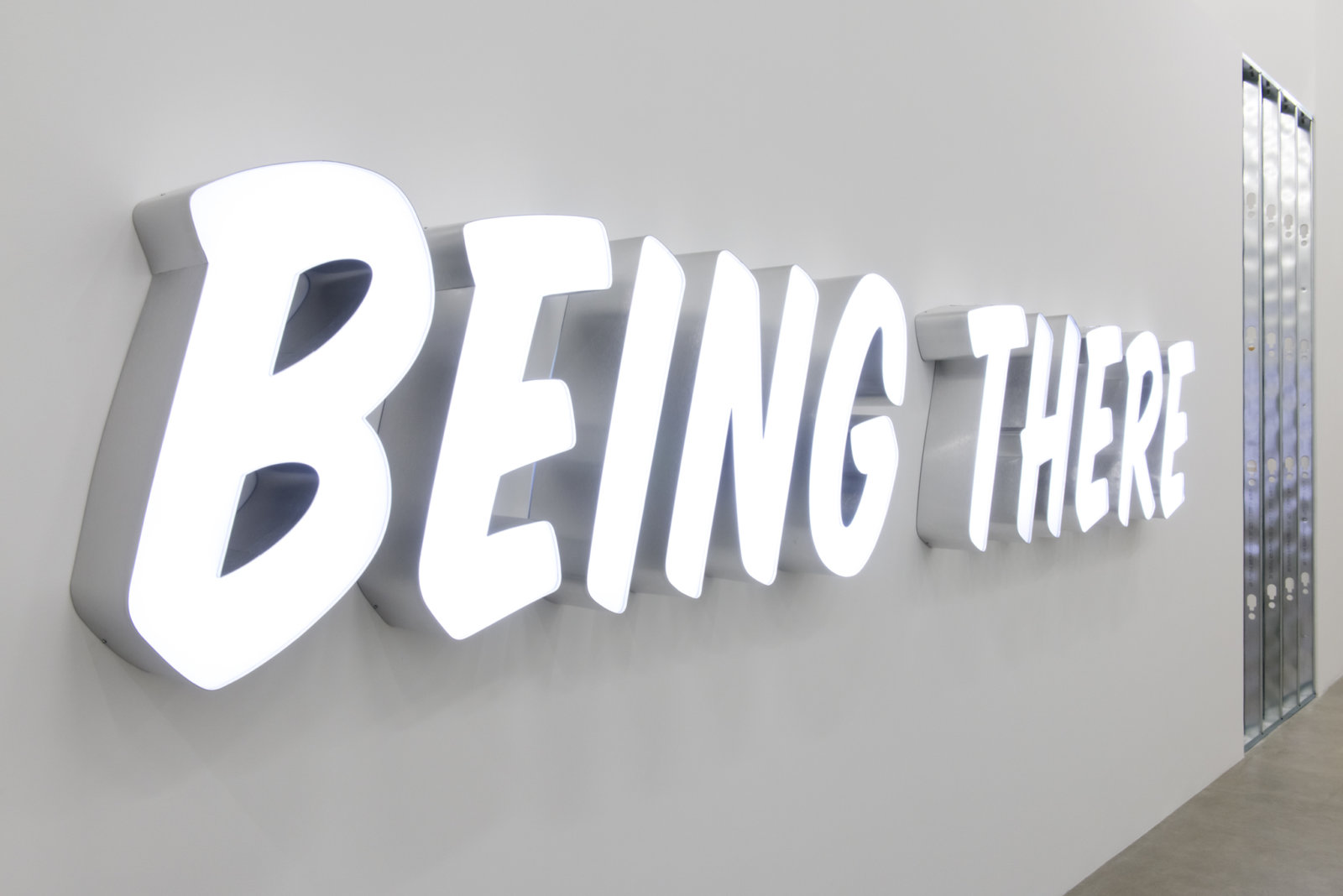 Ron Terada, Being There, 2011, white neon, translucent plexiglas, brushed aluminum, 24 x 165 x 6 in. (61 x 419 x 15 cm)