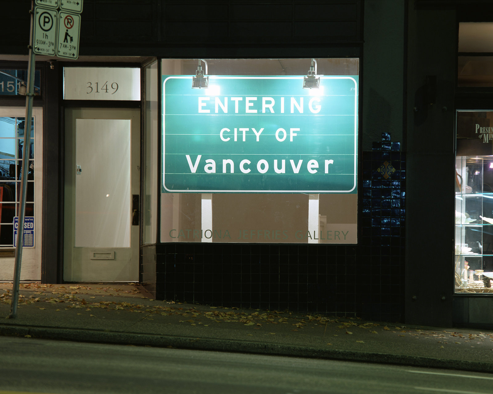 Ron Terada, Entering City of Vancouver, 2002, 3m reflective highway vinyl, extruded aluminum, industrial lights, galvanized steel, wood