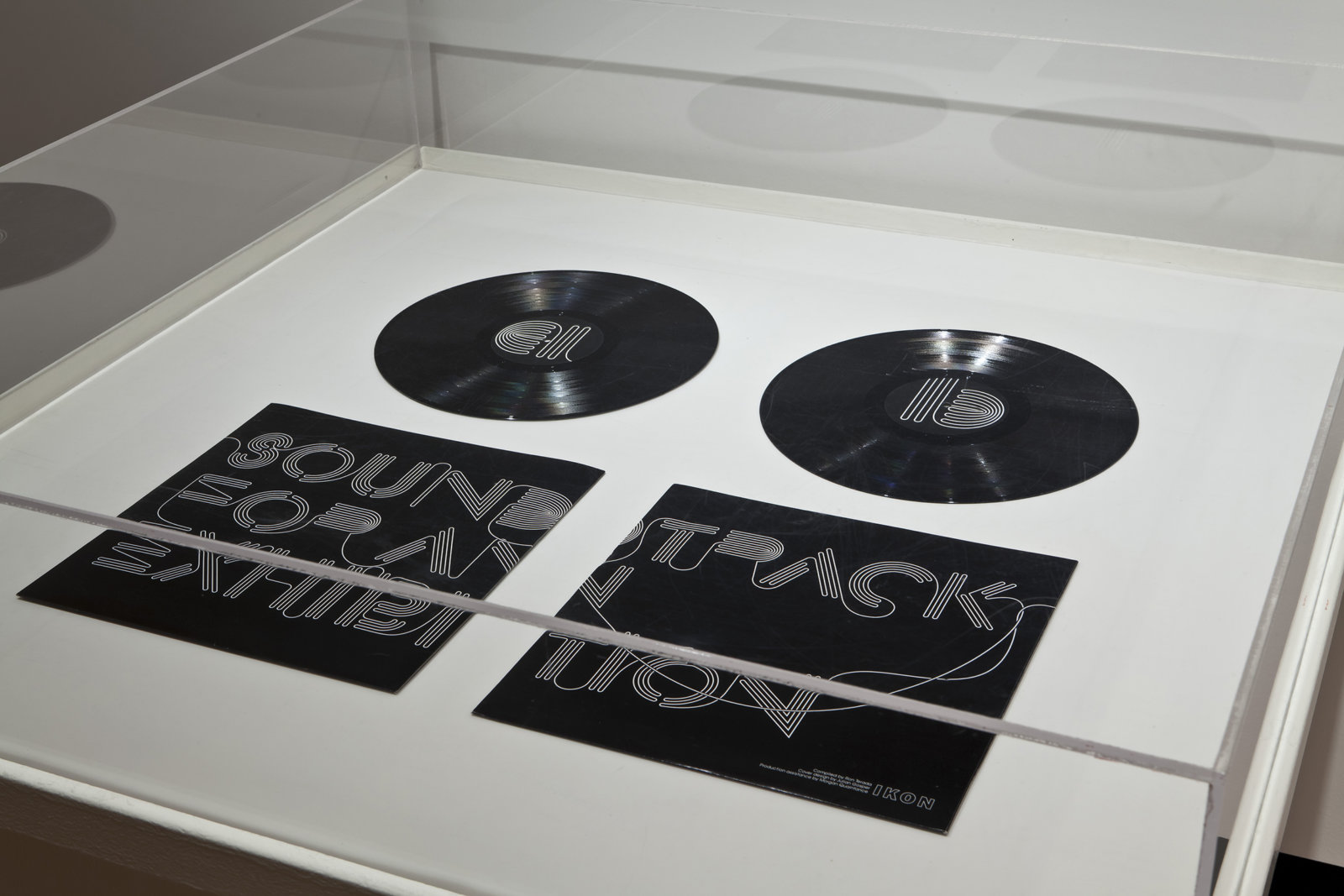 Ron Terada, Soundtrack for an Exhibition, 2010, vinyl record, 12 x 10 in. (30 x 25 cm). Installation view, Who I Think I Am, Justina M. Barnicke Gallery, 2011