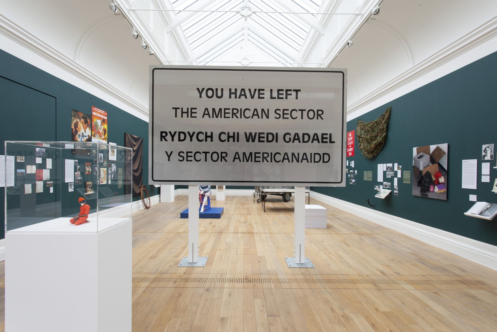 Ron Terada, You Have Left the American Sector, 2005/2015, 3m reflective highway vinyl, extruded aluminum, galvanized steel, wood, 120 x 120 x 16 in. (305 x 305 x 41 cm). Installation view, WAR II, MOSTYN, Llandudno, UK, 2015