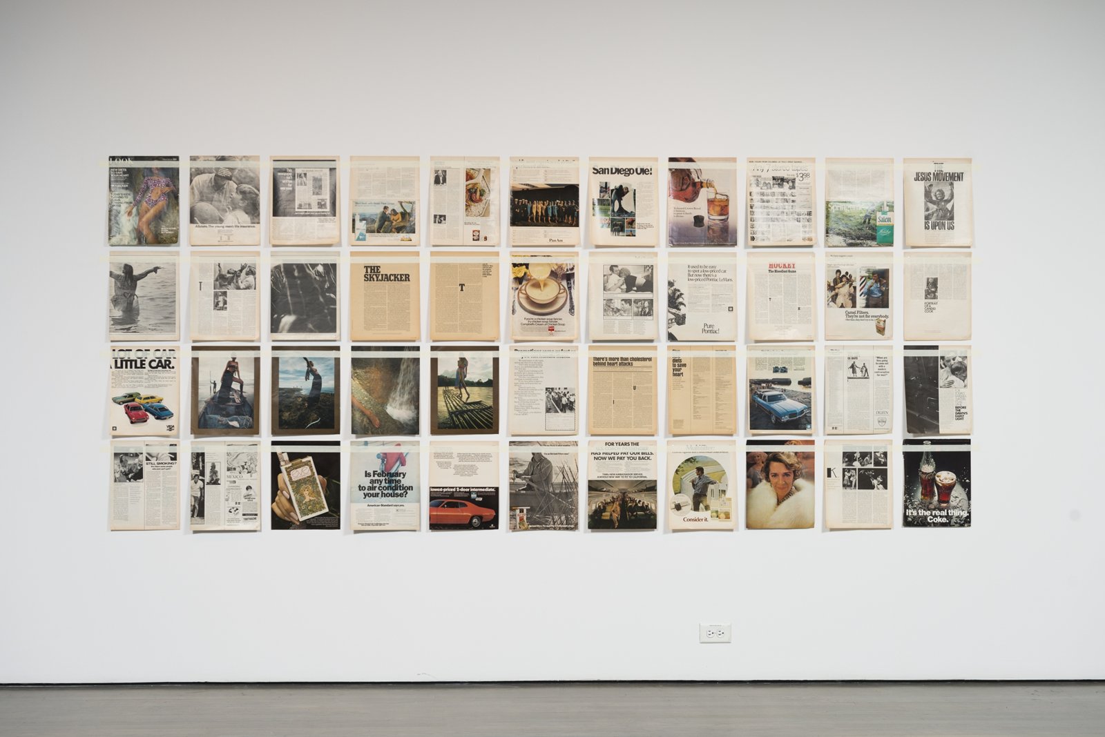 Ian Wallace, Magazine Piece, 1970–ongoing, magazine pages, tape, dimensions variable. Installation view, Qui parle? / Who Speaks?, Leonard and Bina Ellen Art Gallery, Montreal, 2018