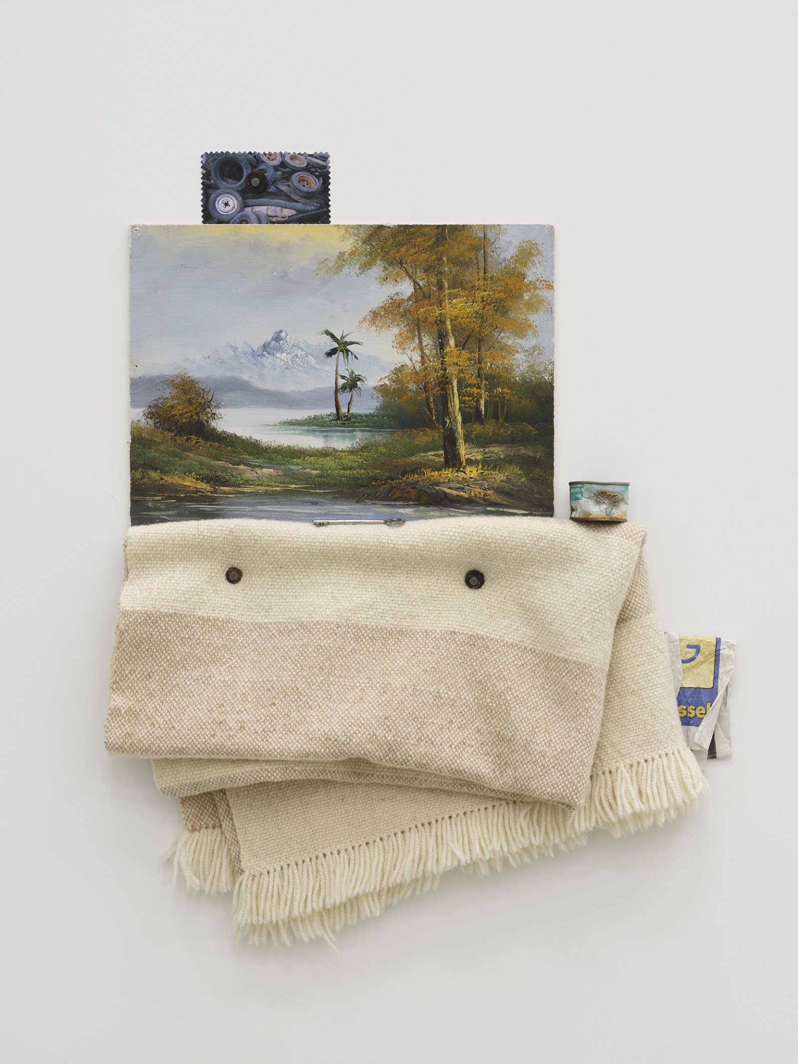 Ashes Withyman, Blanket (yew) from a place, near the buried canal, 2012–2016, found painting, photograph, advertising flyer, tin, door key, coins, nails, handspun wool dyed with yew woven by Anne Low, 30 x 24 in. (75 x 60 cm)